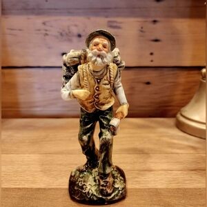 Vintage woodchopper figurine. Hand Painted.